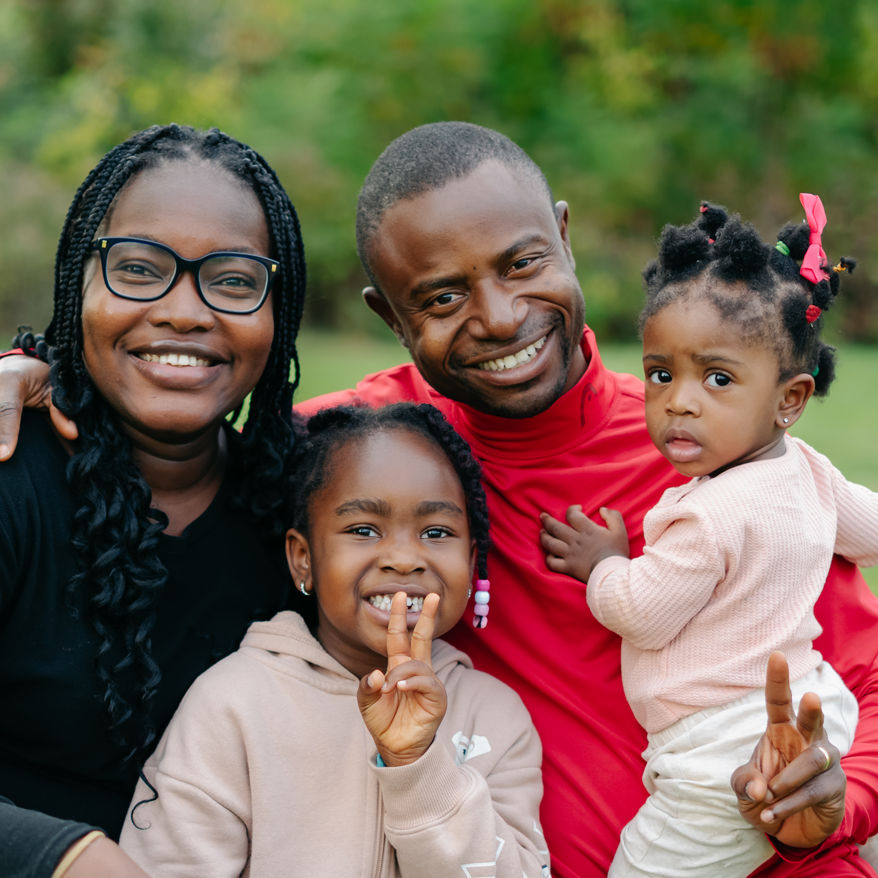  A parenting student smiles with his family